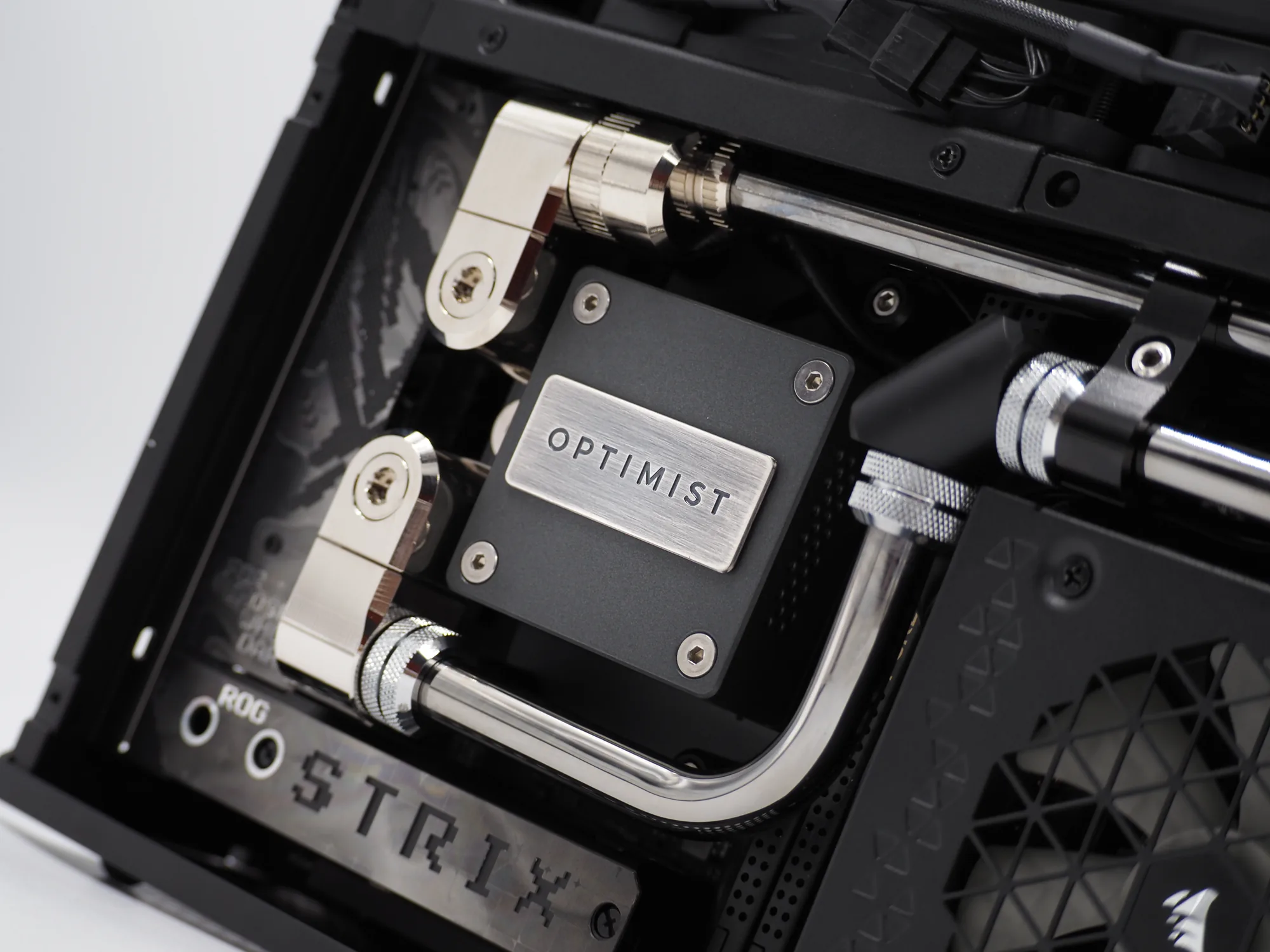 The machined OPTIMIST badge on the water-block